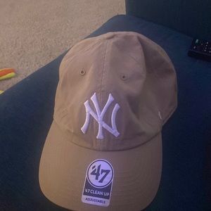 Khaki New York Yankee Cap.